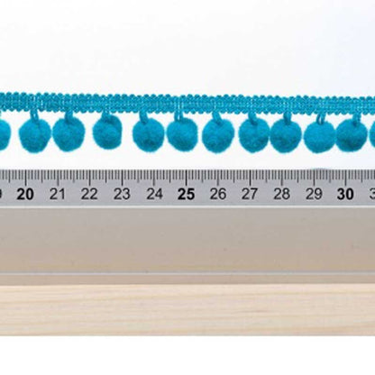 Galon pompon bleu turquoise 18mm dans Galons pompons par Couture et Cie